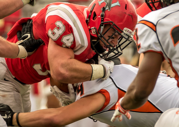 Running back John Iwaniec ran for 122 yards and three touchdowns on 17 carries in Saturday's playoff win over Hendrix. (Photo by Christopher Morgan Photography)