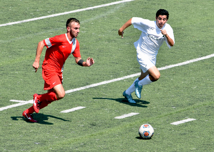 Bo Jenkins (in red) scored in the 79th minute of a 1-0 victory over William Peace on Sunday to help the Hawks earn their first USA South win of the season. (Photo by Wesley Lyle)