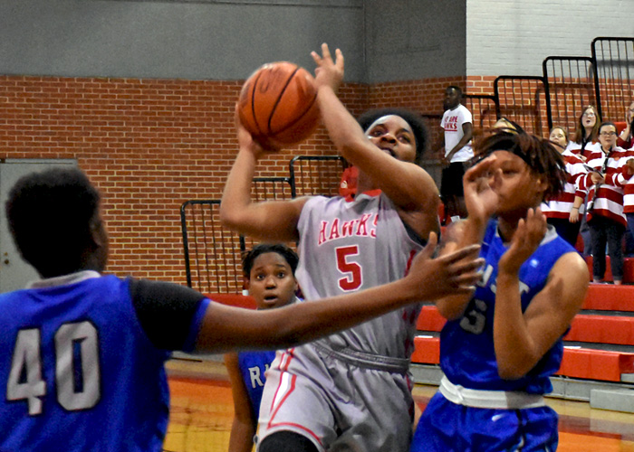 Maia Hill drives to the basket for two of her 19 points in Wednesday's win over Rust College.