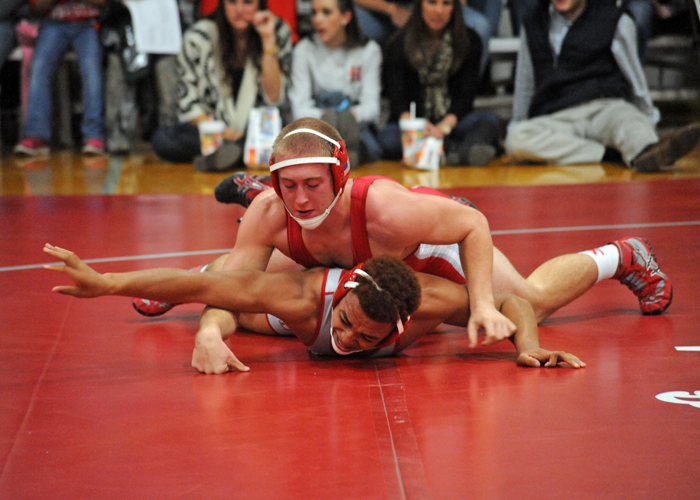 Aidan Talorico (in red) battles for position with Deon Maxwell in the Hawks' Scarlet and Grey Match. (Photo by Wesley Lyle)
