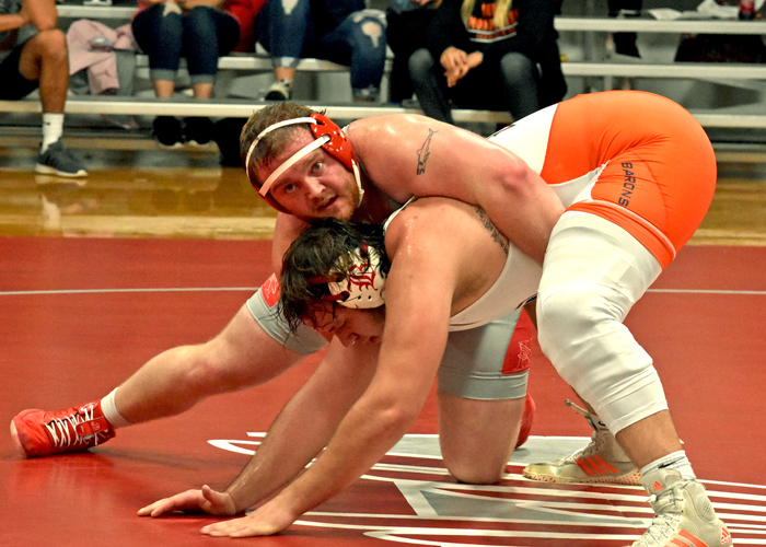 Joseph Pearson recorded a pin in the 285-pound weight class to help Huntingdon clinch a 24-23 win on Sunday. (Photo by Wesley Lyle)