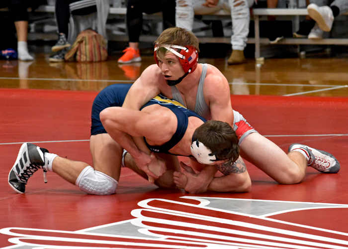 Mason Blakeney earned a pin in the 141-pound weight class in Tuesday's match against Emmanuel College. (Photo by Wesley Lyle)